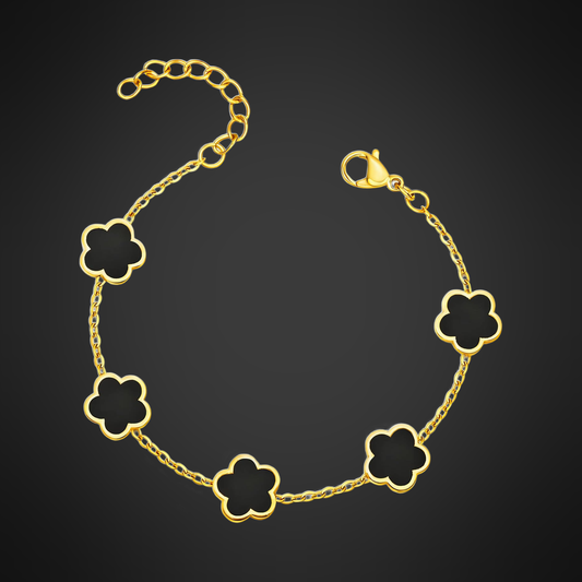 Black Flower Bracelet in PVD gold over 316L stainless steel, five black flower stations on a fine chain, on a black ground