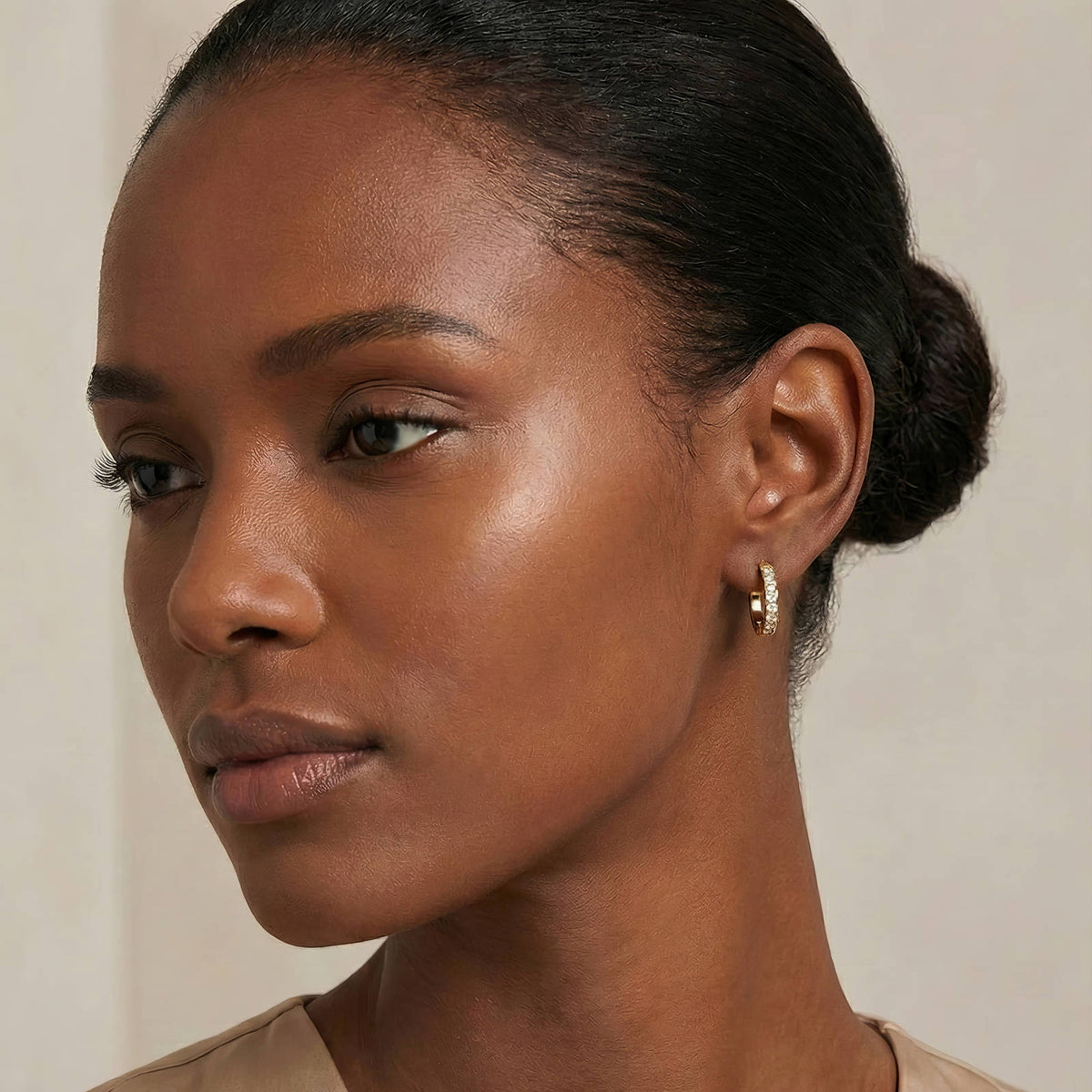 Pavé Huggie Hoops worn on the ear