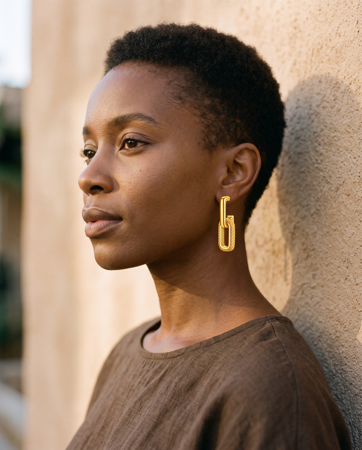 Linked Chain Earrings worn on the ear in late daylight