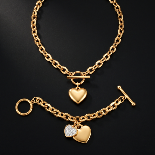 The Hearts Bundle - heart toggle necklace and pave hearts bracelet laid flat on black