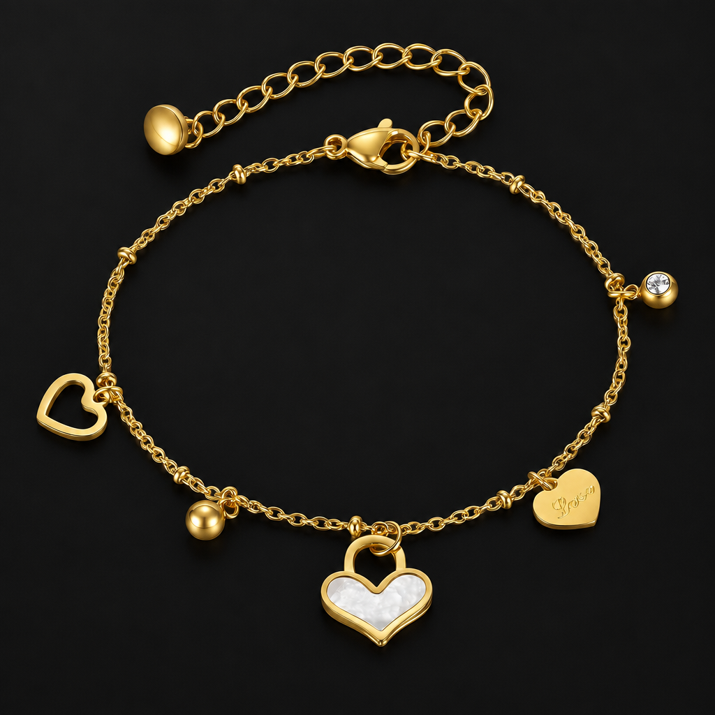 Heart Charm Bracelet in PVD gold over 316L stainless steel, gold and white heart charms on a fine chain, on a black ground