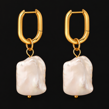 Baroque Pearl Hoops in PVD gold over 316L stainless steel with a freshwater pearl drop, on a black ground
